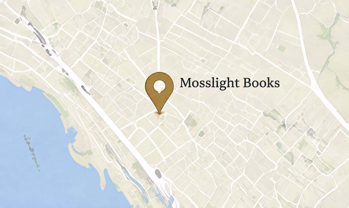 Street map of Burlington, Vermont, with a gold pin marking Mosslight Books near the lakeshore